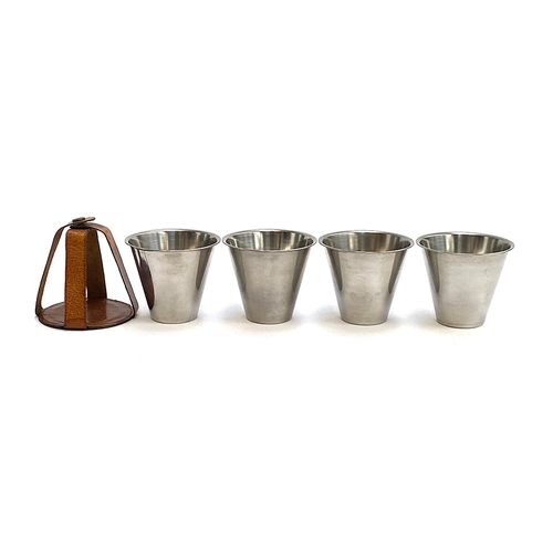 40 - A set of four stainless steel stirrup cups in leather strap case