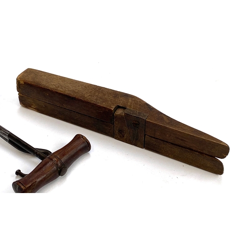 41 - A folding wooden boot jack; together with a pair of boot pulls