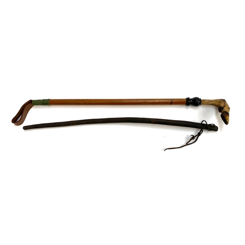 5 - A cane whip with deer slot handle, 61cmL; together with a bull's pistle schooling whip, 59cmL (2)