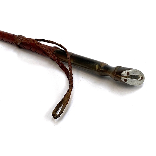 6 - A cutting whip, the horn handle with white metal shoe, 61cmL