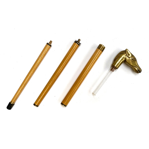 43 - A three piece walking stick with brass horse's head handle, concealing a small glass flask, 91cmL