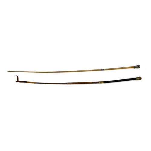 14 - Two cutting whips, each with chased pommels and white metal collars, 63cm and 55cmL