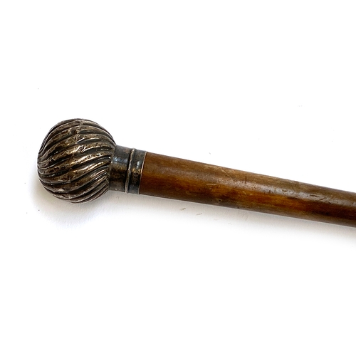 24 - A silver knopped walking cane by Brigg, the knop spirally fluted, hallmarked for London 1891, 91cmL