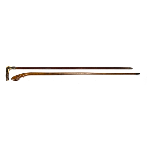 31 - A walking cane with white metal collar and antler handle, 92cmL; together with one other cane (2)