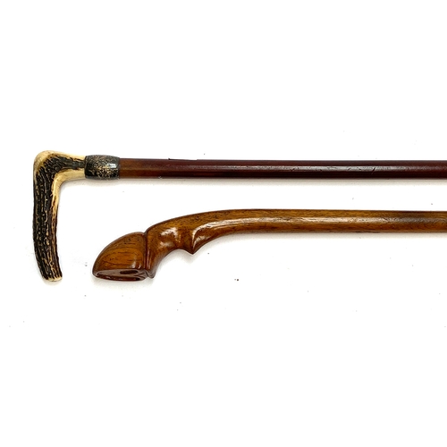 31 - A walking cane with white metal collar and antler handle, 92cmL; together with one other cane (2)