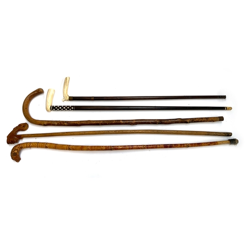 33 - Five various walking sticks, two with bone handles (5)