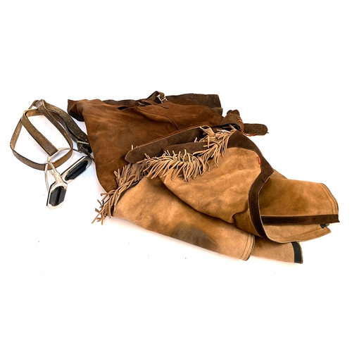 47 - Two pairs of suede chaps; together with a pair of stirrups