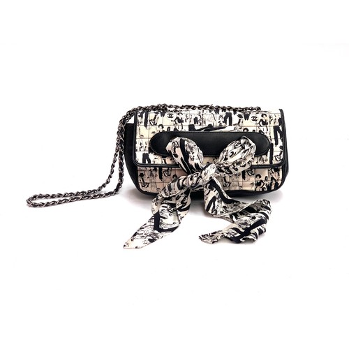 A Chanel 'Chocolate Bar' scarf flap bag designed by Karl Lagerfeld c.2003/4, black and white quilted silk depicting Gabrielle Chanel and models, black lambskin leather trim with silver hardware, the scarf removeable, numbered inside, approx. 26cmW