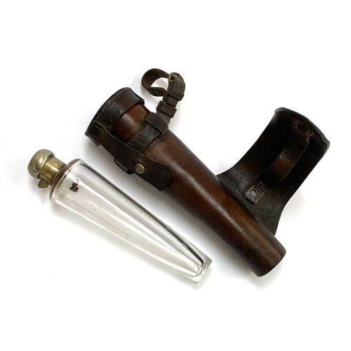 39 - A conical glass hunting saddle flask, 19.5cmL, in a fitted leather case