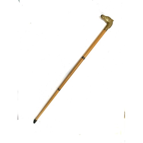 43 - A three piece walking stick with brass horse's head handle, concealing a small glass flask, 91cmL