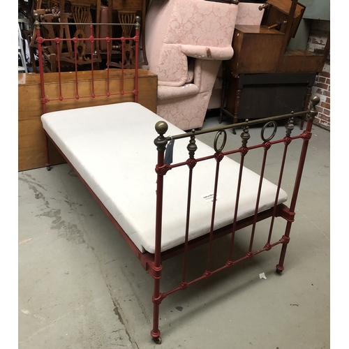 1751 - A good pair of brass, iron, and red painted single beds