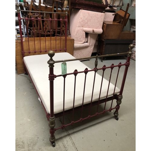 1751 - A good pair of brass, iron, and red painted single beds