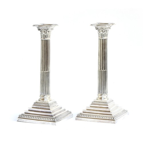 100 - A pair of large loaded silver candlesticks in Neoclassical style, by Hawksworth, Eyre & Co Ltd, Shef... 