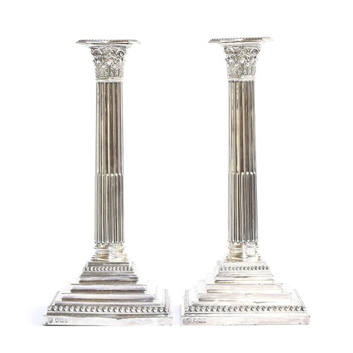 100 - A pair of large loaded silver candlesticks in Neoclassical style, by Hawksworth, Eyre & Co Ltd, Shef... 