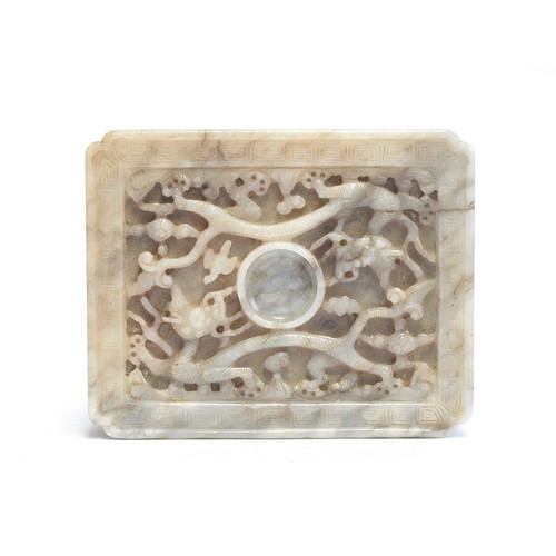 205 - A Chinese grey jade cup stand, of rectangular panel form with canted corners, intricately carved in ... 