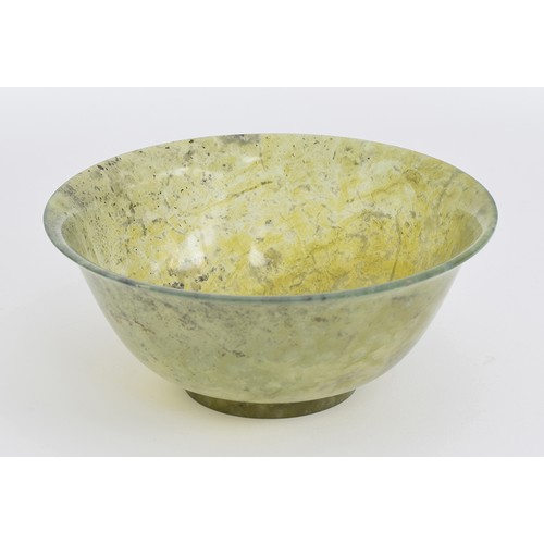 206 - A Chinese carved spinach jade bowl, 15cm diameter