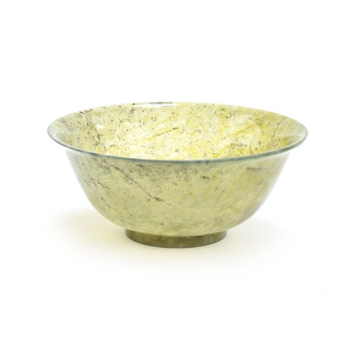 206 - A Chinese carved spinach jade bowl, 15cm diameter