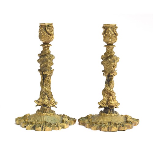 150 - A good pair of 19th/early 20th century ormolu candlesticks, in rococo taste, in the form of four ent... 