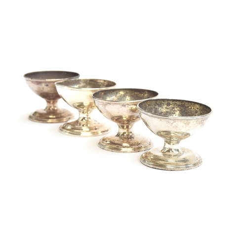 67 - A set of four George III silver salts by Joseph Wyatt, London 1790, stemmed, on spreading circular f... 