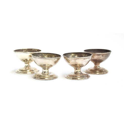 67 - A set of four George III silver salts by Joseph Wyatt, London 1790, stemmed, on spreading circular f... 