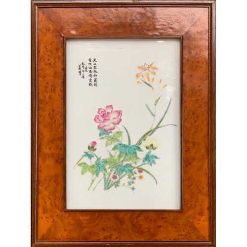 217 - A set of four Chinese famille rose porcelain plaques, each painted depicting magnolias, chrysanthemu... 