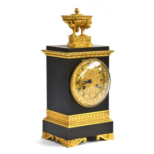 347 - A 19th century French bronze and ormolu mantel clock, surmounted with an urn supported by swans, the... 