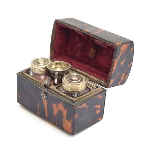 134 - A 19th century miniature tortoiseshell travel inkwell, fitted interior with cut glass bottles and pe... 