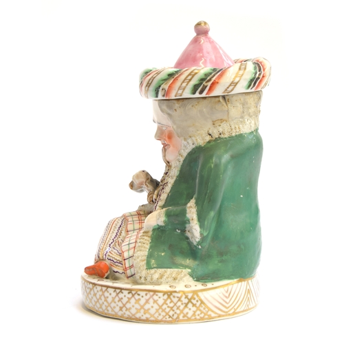 169 - A 19th century Staffordshire tobacco jar in the form of a seated Turk, 19.5cm high