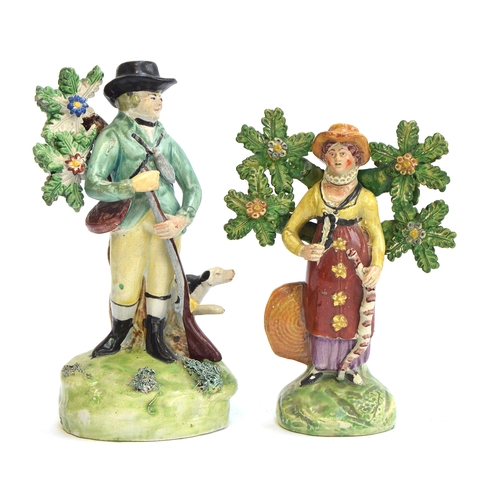 170 - Two early 19th century Staffordshire pearlware figurines with bocage tree detail, one stamped Walton... 