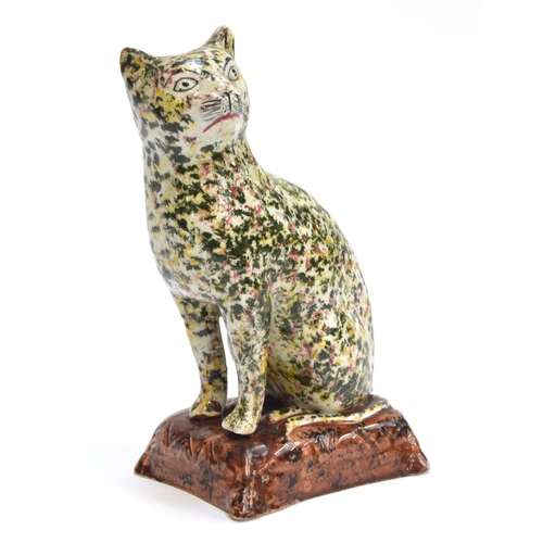 166 - A rare 19th century Scottish pearlware figure of a seated cat, sponged in Portobello type colours of... 