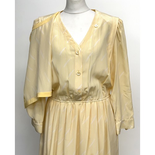 676 - A vintage Louis Feraud yellow and white striped silk dress, with button-wrap front panel, viscose li... 