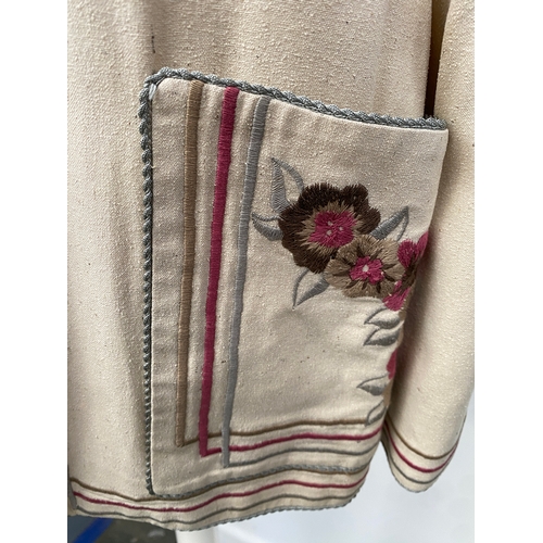 709 - A vintage Janice Wainright linen jacket with embroidered trim and pocket detail, bears label 'by Jan... 