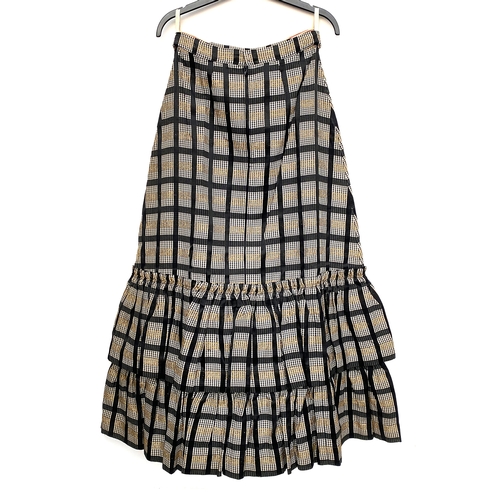 717 - A lot of eight vintage skirts: two ruffled, one brown and white striped, the other gingham, floral, ... 