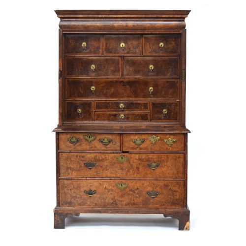 363 - An early 18th century walnut veneer cabinet on chest, the moulded cornice above a cushion frieze dra... 