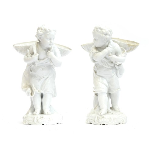 174 - A pair of Meissen style blanc de chine figures of a young boy and girl carrying baskets (af), underg... 