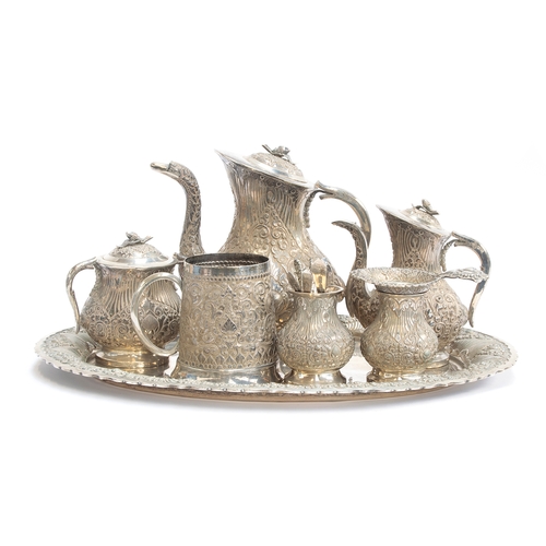 58 - An Indonesian .800 silver tea/coffee set, comprising a teapot, coffee pot, sugar bowl, tea strainer ... 