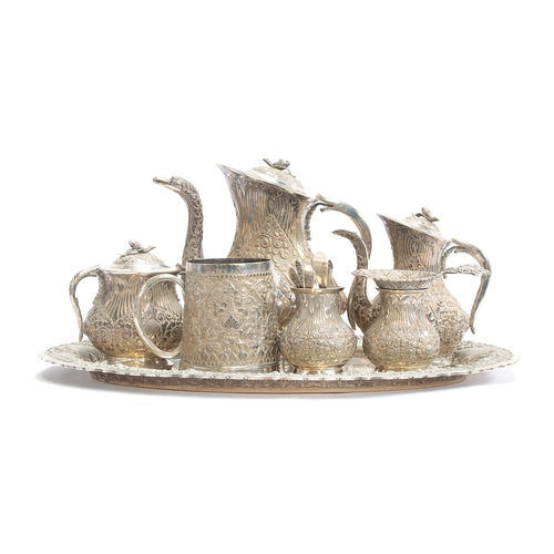 58 - An Indonesian .800 silver tea/coffee set, comprising a teapot, coffee pot, sugar bowl, tea strainer ... 