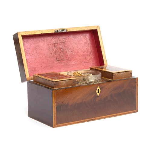 133 - An early 19th century mahogany and crossbanded tea caddy, complete with two lined canisters and glas... 