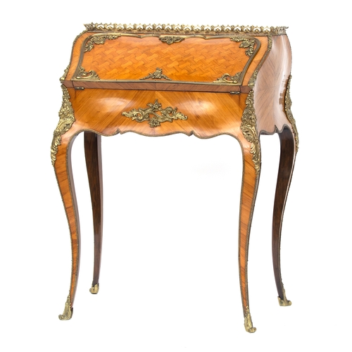 439 - An early 20th century French kingwood and ormolu mounted bonheur du jour, the parquetry fall front o... 