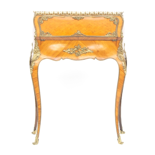 439 - An early 20th century French kingwood and ormolu mounted bonheur du jour, the parquetry fall front o... 