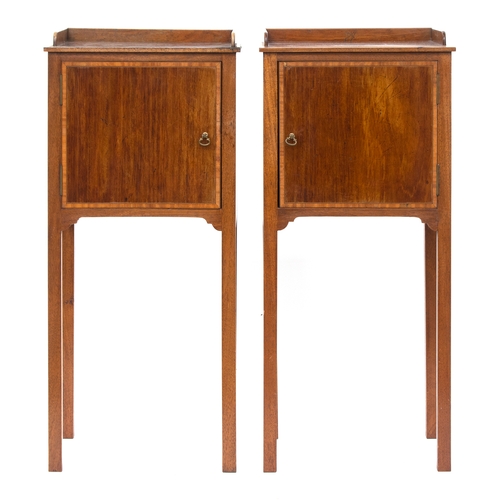 445 - A pair of Georgian revival mahogany bedside pot cupboards, each with three quarter gallery over cupb... 