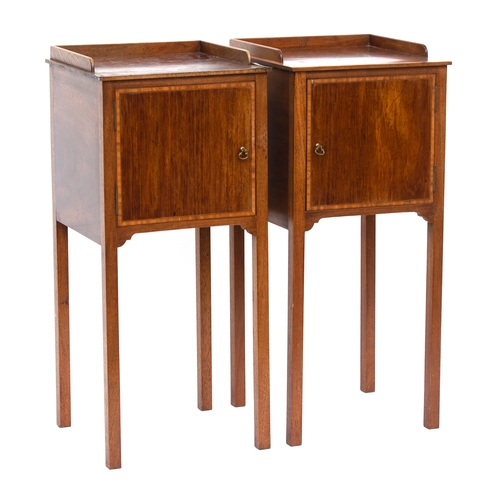 445 - A pair of Georgian revival mahogany bedside pot cupboards, each with three quarter gallery over cupb... 