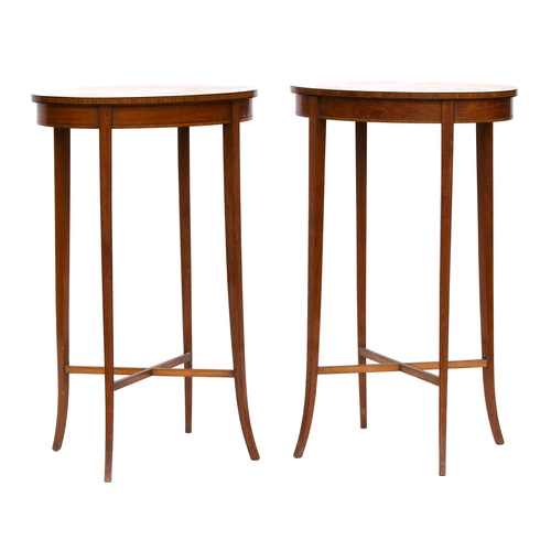 442 - A pair of Edwardian mahogany lamp tables, oval, each with central shell patera, on four square taper... 