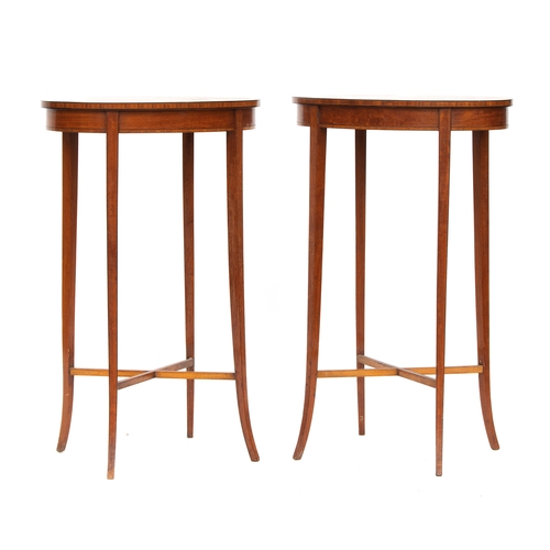 442 - A pair of Edwardian mahogany lamp tables, oval, each with central shell patera, on four square taper... 