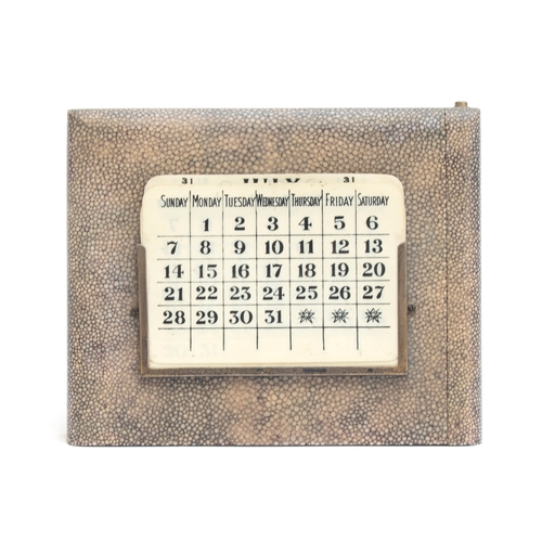 106 - An early 20th century shagreen and silver mounted perpetual desk calendar, with interchangeable cell... 