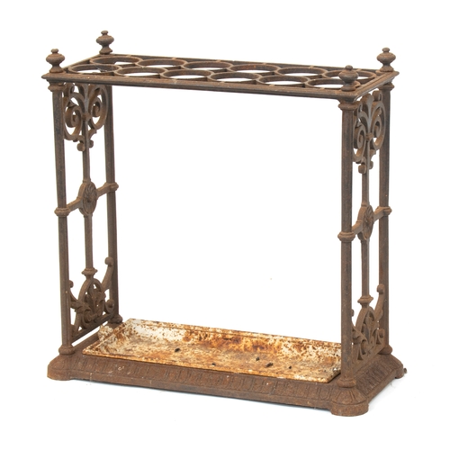 434 - A Victorian cast iron stick stand, with drip tray, 62cm wide, 26cm deep, 64cm high