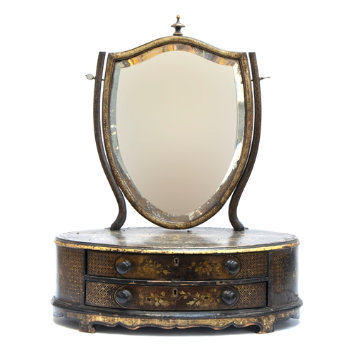 330 - A 19th century Chinese export dressing mirror, the bevelled shield shaped plate on an oval base of t... 