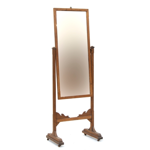 463 - An oak Arts & Crafts cheval mirror, the rectangular plate within a chamfered oak frame, on chamfered... 