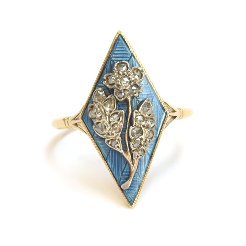 7 - An 18ct gold late 19th/early 20th century ring, blue enamel lozenge panel set with a diamond encrust... 