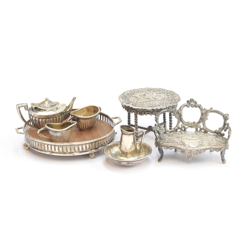 98 - An early 20th century miniature silver dolls tea set, comprising galleried teapot, 3cm high, galleri... 